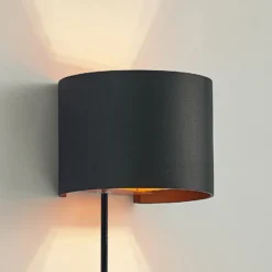 Aplique de pared Arcchio Zuzana, redondo, negro, enchufe, 13 cm