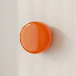 Aplique de pared BonBon, naranja, Ø 16 cm, cristal