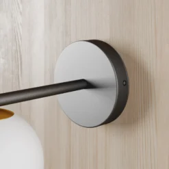 Aplique de pared Gama en negro con bola de cristal