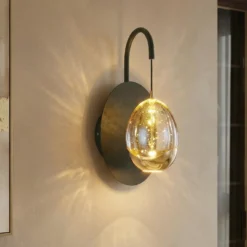 Aplique de pared Golden Egg, negro/ámbar, altura 28 cm, metal/vidrio