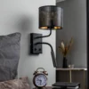 Aplique de pared Jovin de 1 luz con foco negro/dorado