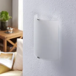 Aplique de pared LED Lindby Helmi, altura 21 cm, cristal, semicircular