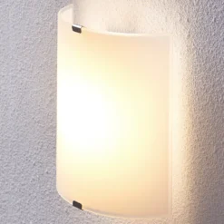 Aplique de pared LED Lindby Helmi, altura 21 cm, cristal, semicircular