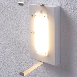 Aplique de pared LED Lindby Helmi, altura 21 cm, cristal, semicircular