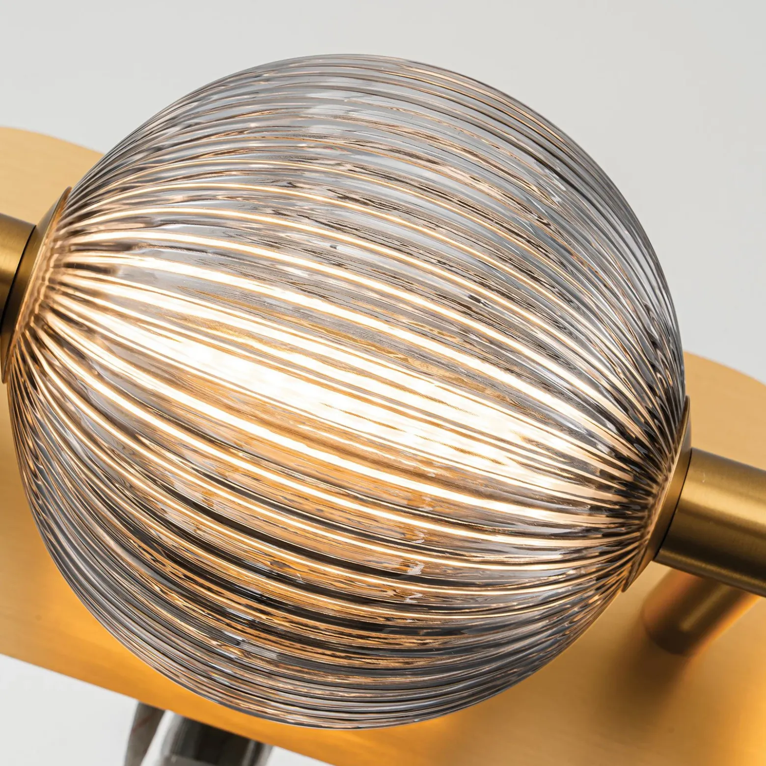Aplique de pared LED PALMAS dorada/gris humo Ancho 59 cm 3 luces IP44