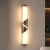 Aplique de pared LED Wrap, IP44, bronce, metal, cristal, 3.000 K