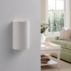 Aplique de pared Lindby Colja, redondo, altura 16 cm, escayola, blanco