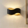 Aplique de pared Lindby Dailin, negro/dorado, 30 cm, metal