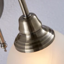 Aplique de pared Lindby Hanna, 18 m, latón envejecido, metal, cristal