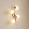 Aplique de pared Lindby Josiana, ópalo/latón, 48 cm, esférico, cristal