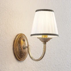 Aplique de pared Lindby Lumiel, crema/latón, textil, 27cm