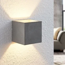Aplique de pared Lindby Nellie, gris, hormigón, 11,5 cm de ancho