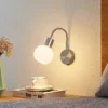Aplique de pared Lioma de Lindby con brazo flexible, níquel