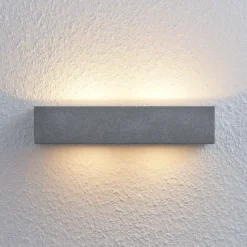 Aplique de pared Nellie de Lindby, gris, hormigón, 35,3 cm de ancho