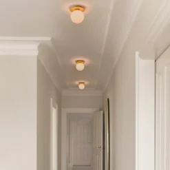 Aplique de pared Nuura Liila 1 Medium, dorado/rosa, IP44, G9