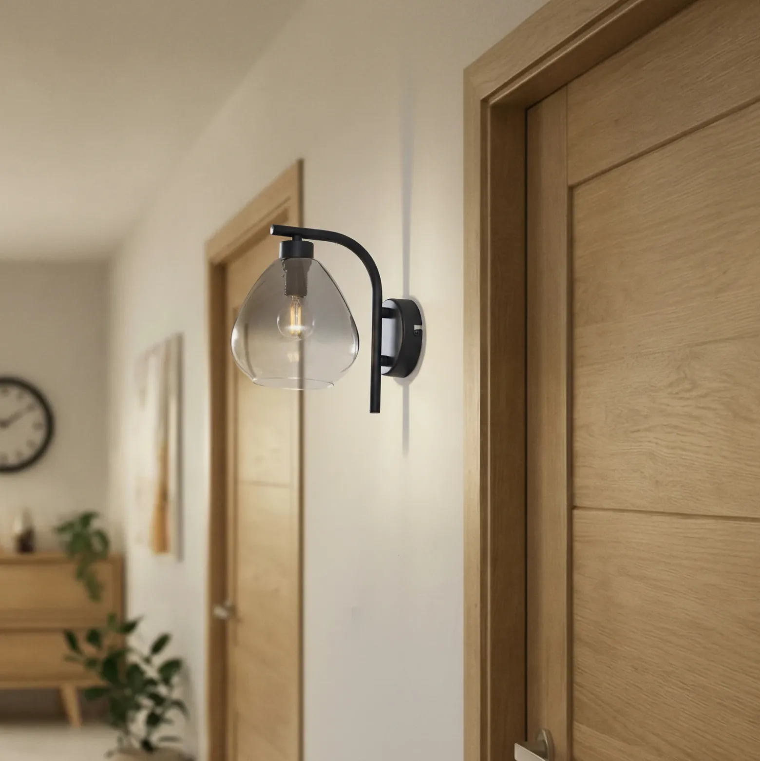 Aplique de pared Pendura de Lindby, Ø 15 cm, negro, cristal