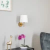 Aplique de pared Polo Plus con pantalla textil, latón/crema