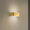 Aplique de pared Rauma, latón, ancho 20 cm