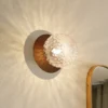 Aplique Nuura Liila 1, Ø 14 cm, IP44, bronce/transparente