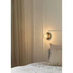 Aplique Nuura Liila 1, Ø 14 cm, IP44, negro/transparente