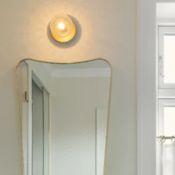 Aplique Nuura Liila 1, IP44, Ø 14 cm, dorado/transparente