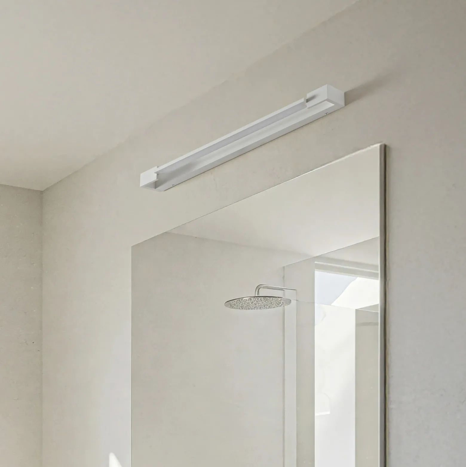 Arcchio Aplique de pared LED Jora, 60 cm, blanco, orientable, IP44