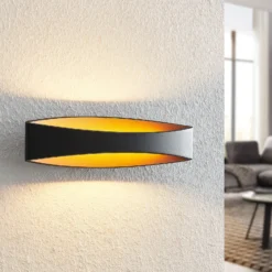 Arcchio Aplique de pared LED Jelle, 44 cm, negro/oro, arriba/abajo