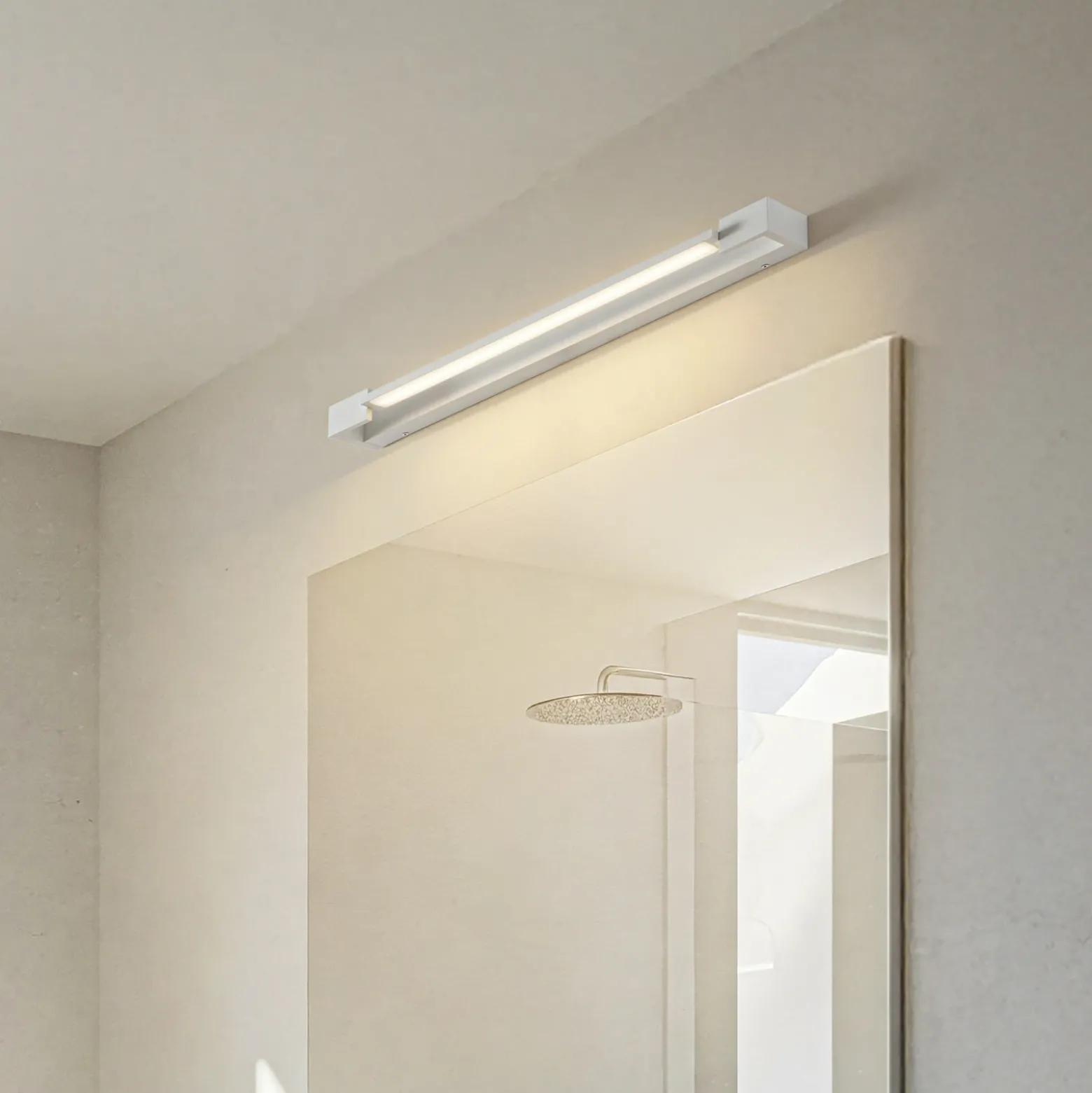 Arcchio Aplique de pared LED Jora, 60 cm, blanco, orientable, IP44