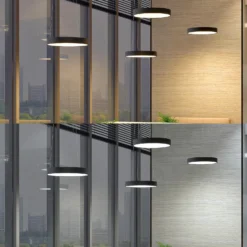 Arcchio Lámpara colgante LED Aleksi, Ø 60 cm, negra, metal, CCT
