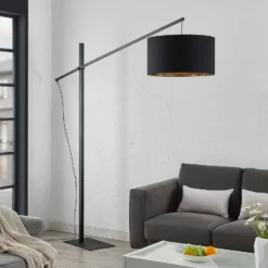 Arcchio lámpara de pie arqueada Mossa, 200 cm, negro-oro, textil