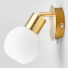 Foco de pared Lindby Elaina, color latón, cristal, 14 cm de altura, E14