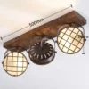 Foco Lindby Tamin, 48 cm, color óxido, 3 luces, cristal