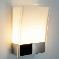 Lindby Aplique de pared Malthe, altura 27 cm, cromo, vidrio, metal