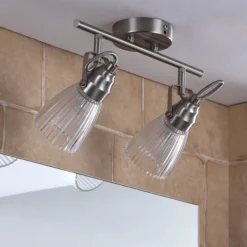 Lindby Aplique para baño Kara, 31 cm, 2 luces, cristal, IP44, G9