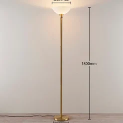 Lindby lámpara de pie Ignacia, color latón, cristal, 180 cm, E27