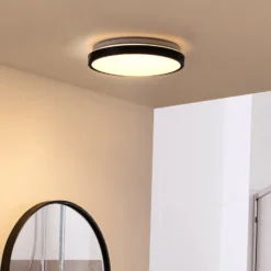 Lindby Lámpara de techo LED Medon Ø 29 cm plástico negro IP44