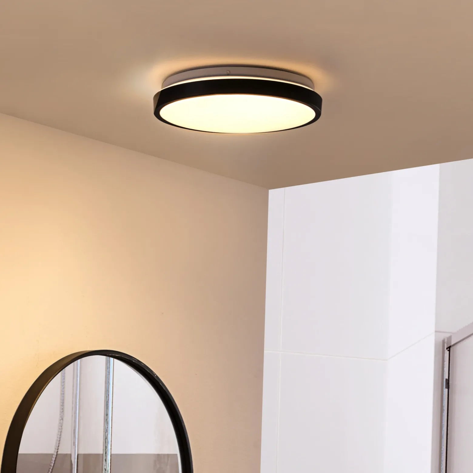 Lindby Lámpara de techo LED Medon Ø 29 cm plástico negro IP44