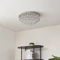 Lindby plafón Antonino, 8 luces, cromo, cristal, 55cm