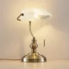 Lindby Profina lámpara de mesa, bronce