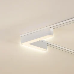 Lindby Tira LED 48 V Lumaro,blanca,forma de L,plástico,atenuable