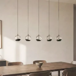 Lámpara colgante LED Lucande Hayley, negra, 5 luces, alargada
