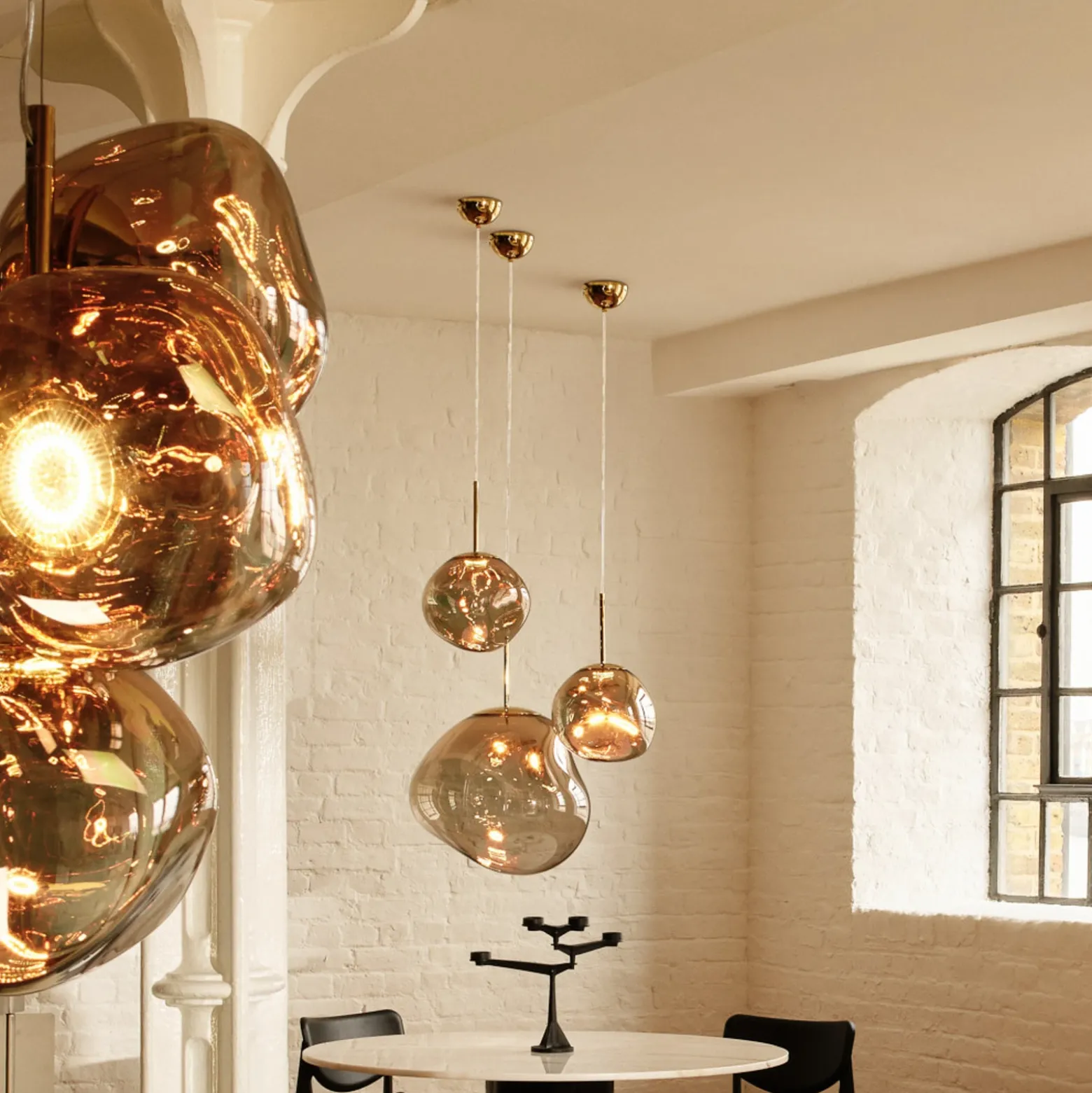 Lámpara colgante LED Melt de Tom Dixon, Ø 50 cm, color bronce