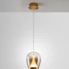 Lámpara colgante LED Suspiro, Ø 18 cm, color dorado/ámbar, cristal