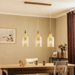 Lámpara colgante Lindby Drakar, 3 luces, ámbar, cristal, Ø 19,5 cm