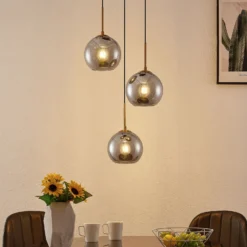 Lámpara colgante Lindby Jurian, 32 cm, 3 luces, bronce, humo, cristal