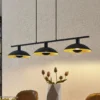 Lámpara colgante Lindby Narisara, 118cm, E14, 3 luces, negro-oro