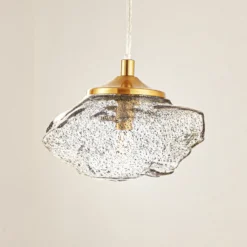 Lámpara colgante Lindby Piatra, humo/latón, cristal, Ø 16 cm, G9