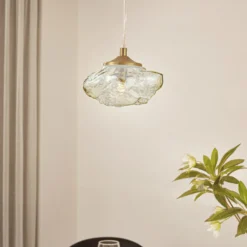 Lámpara colgante Lindby Piatra, ámbar/latón, cristal, Ø 16 cm, G9