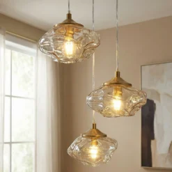 Lámpara colgante Lindby Piatra, Ø25cm, 3 luces, coñac/latón, cristal