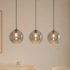 Lámpara colgante Lucande Brillar, gris humo, cristal, 3 luces, 128 cm